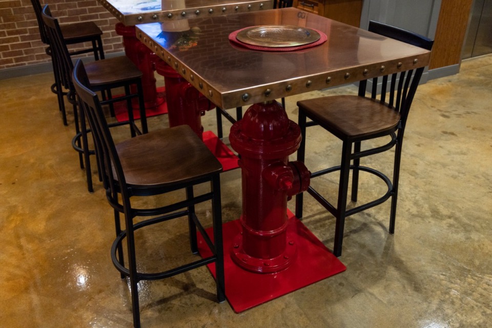 <strong>A fire hydrant serves as the base for tables at the new Memphis Fire Department headquarters.</strong> (Brad Vest/ Special to the Daily Memphian)