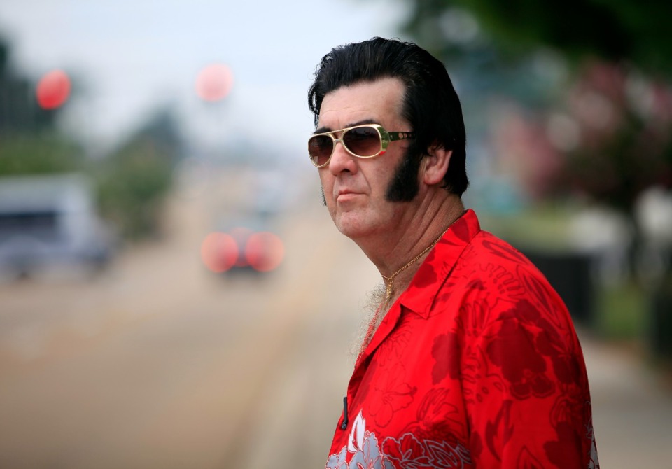 <strong>Elvis tribute artist Rick Presley, who says that he is Elvis' second cousin, pauses along Elvis Presley Boulevard near Graceland in 2010.</strong>&nbsp;(Daily Memphian file)