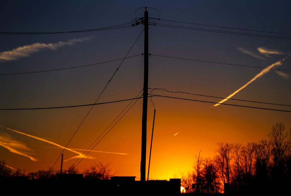 <strong>Power lines run across a field at sunset.&nbsp;</strong> (Patrick Lantrip/Daily Memphian file)