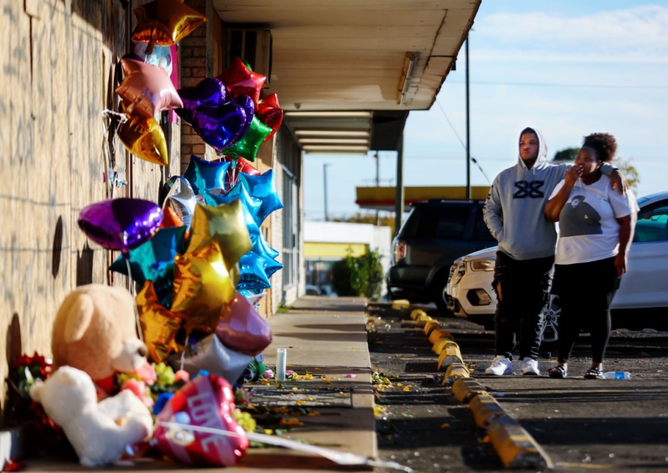 <strong>Memphians visit the makeshift memorial for rapper Young Dolph, who was shot and killed on Nov. 17, 2021, at Makeda's Homemade Cookies on Airways Boulevard.</strong> (Patrick Lantrip/Daily Memphian file)