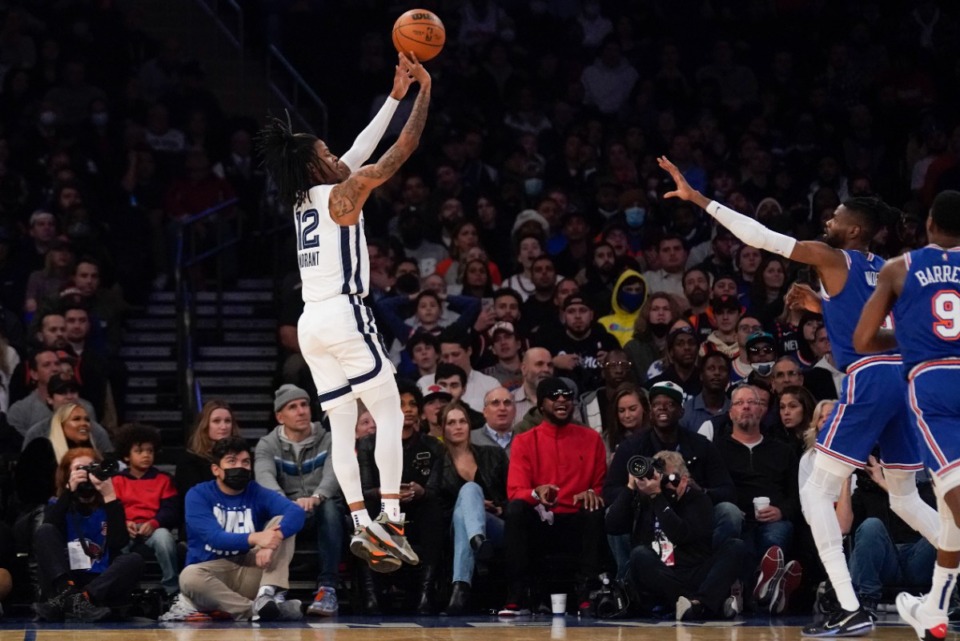 <strong>Grizzlies guard Ja Morant, left, takes a shot against the New York Knicks on Feb. 2, 2022, in New York.</strong> (Seth Wenig/AP)