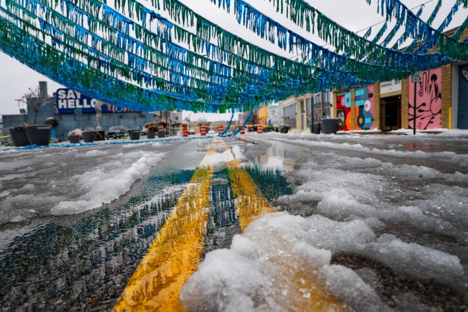 <strong>The Edge District art installation of hula skirt streamers hangs low to the ground after freezing rain hit the area on Thursday, Feb. 3, 2022.</strong> (Mark Weber/The Daily Memphian)
