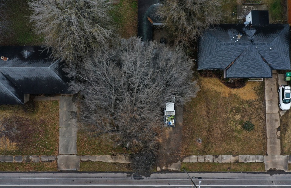 <strong>A drone photo shows a tree collapsed on a house on Quince Road in East Memphis.</strong> (Patrick Lantrip/Daily Memphian)