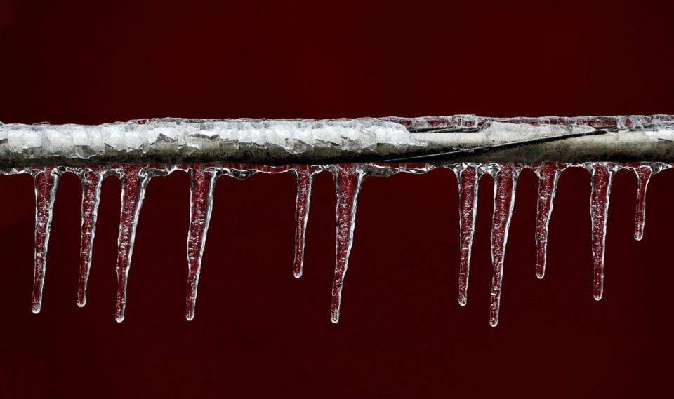 <strong>Icicles form on a fallen power line in South Memphis Feb. 4, 2022.</strong> (Patrick Lantrip/Daily Memphian)