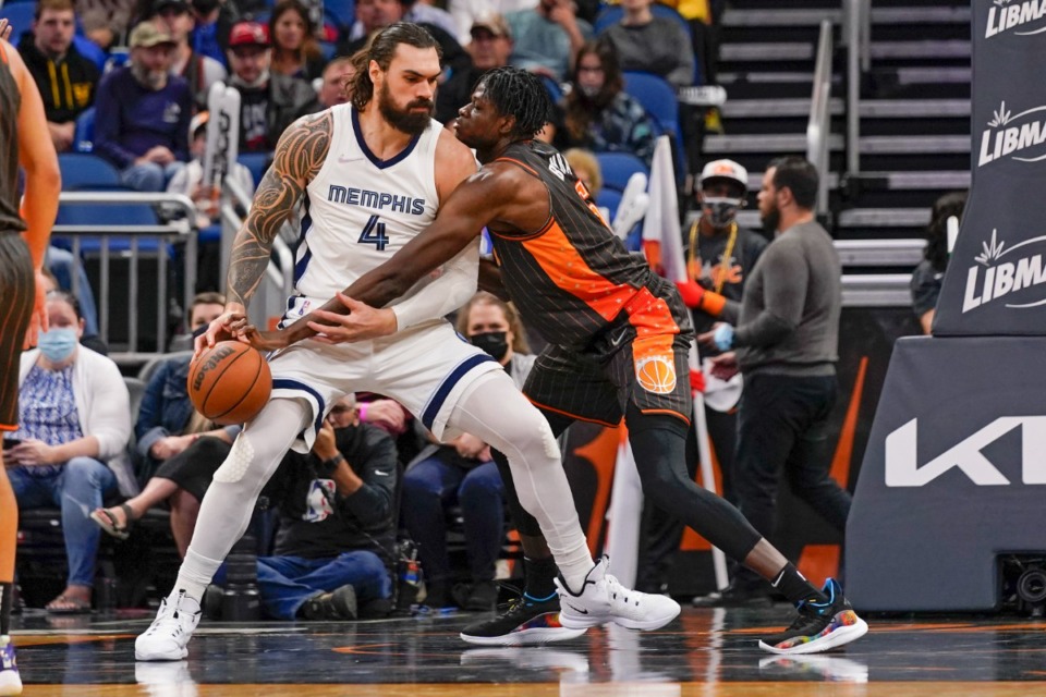 <strong>Memphis Grizzlies center Steven Adams (4) goes to the basket as he is defended by Orlando Magic center Mo Bamba, right, during an NBA basketball game, Saturday, Feb. 5, 2022, in Orlando, Fla.</strong> (AP Photo/John Raoux)