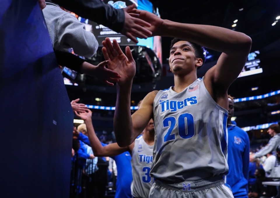 <strong>University of Memphis forward Josh Minott (20) celebrates with fans after a Feb. 5, 2022 game against UCF.</strong> (Patrick Lantrip/Daily Memphian)
