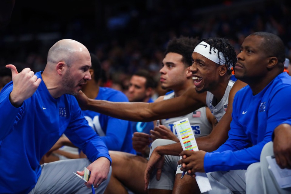 <strong>University of Memphis forward Deandre Williams (12) laughs with coach Cody Toppert during a Feb. 5, 2022 game against UCF.</strong> (Patrick Lantrip/Daily Memphian)