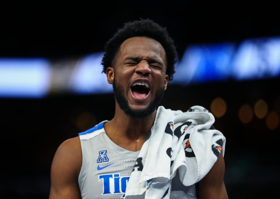 <strong>University of Memphis guard Alex Lomax reacts to a teammates dunk during a Feb. 5, 2022 game against UCF.</strong> (Patrick Lantrip/Daily Memphian)