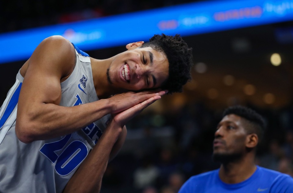 <strong>University of Memphis forward Josh Minott (20) puts the opposition to sleep after closing out a Feb. 5, 2022 game against UCF.</strong> (Patrick Lantrip/Daily Memphian)