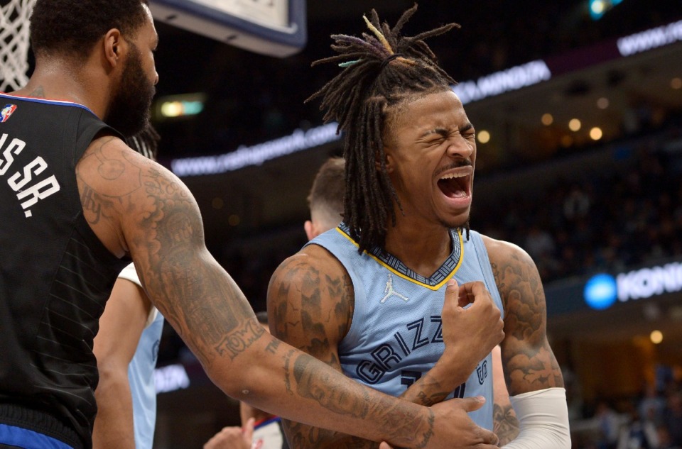 <strong>Memphis Grizzlies guard Ja Morant (12) reacts after being fouled by Los Angeles Clippers forward Marcus Morris Sr., left, on Feb. 8.</strong> (Brandon Dill/AP)