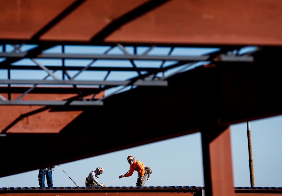 <strong>Construction workers are dwarfed by the Memphis Sports and Events Center as it goes up.</strong> (Mark Weber/The Daily Memphian)