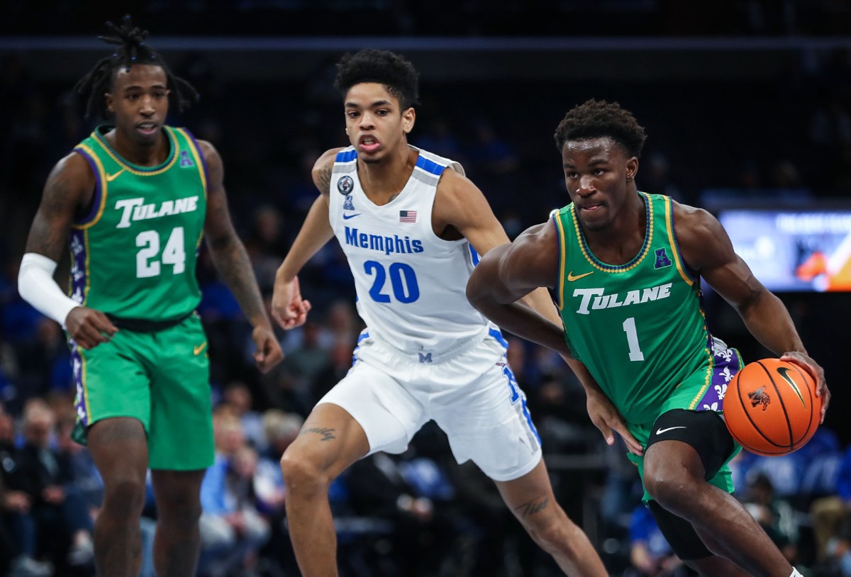 <strong>University of Memphis forward Josh Minott (20) guards Tulane guard Sion James (1) on Feb. 9.</strong> (Patrick Lantrip/Daily Memphian)