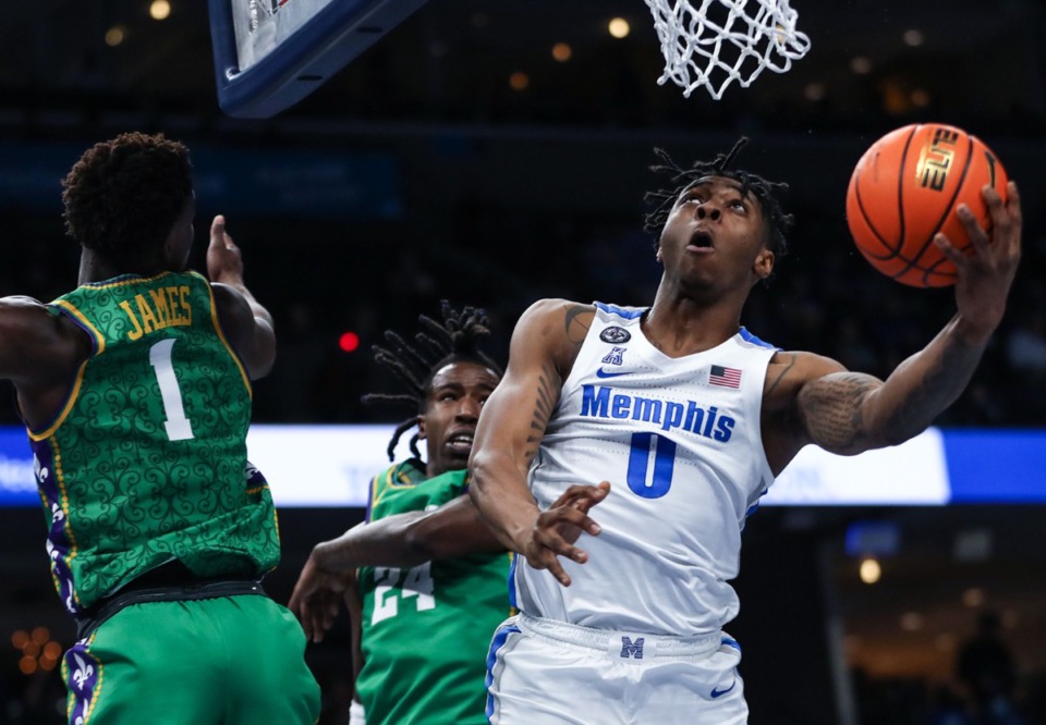 <strong>University of Memphis guard Earl Timberlake (0) goes for a layup during the Feb. 9, 2022, game against Tulane.</strong> (Patrick Lantrip/Daily Memphian)