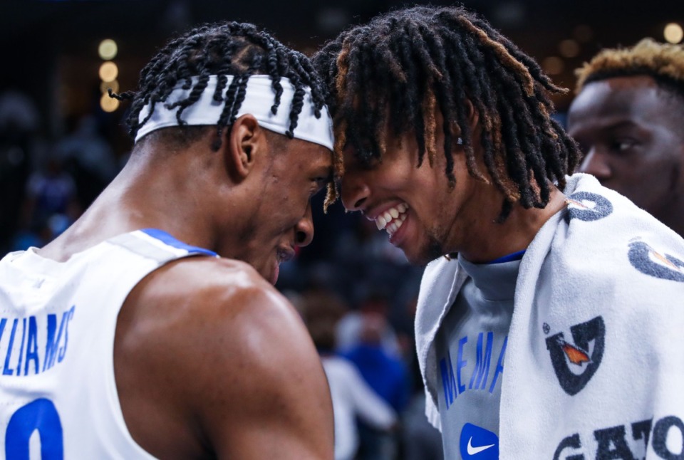 <strong>University of Memphis forward DeAndre Williams (12) celebrates with teammate Emoni Bates after the Feb. 9, 2022, game against Tulane.</strong> (Patrick Lantrip/Daily Memphian)