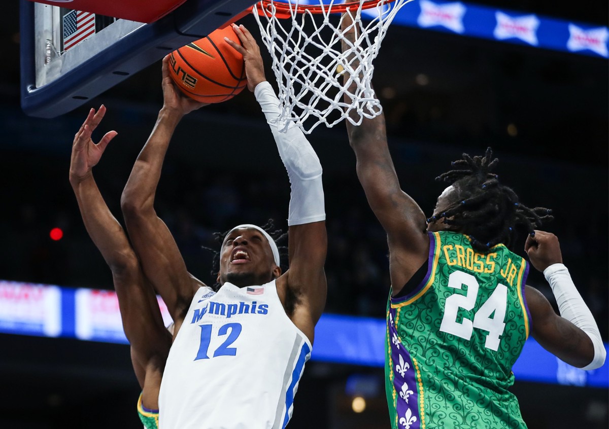 <strong>University of Memphis forward DeAndre Williams (12) goes for a layup on Feb. 9 against Tulane.</strong> (Patrick Lantrip/Daily Memphian)