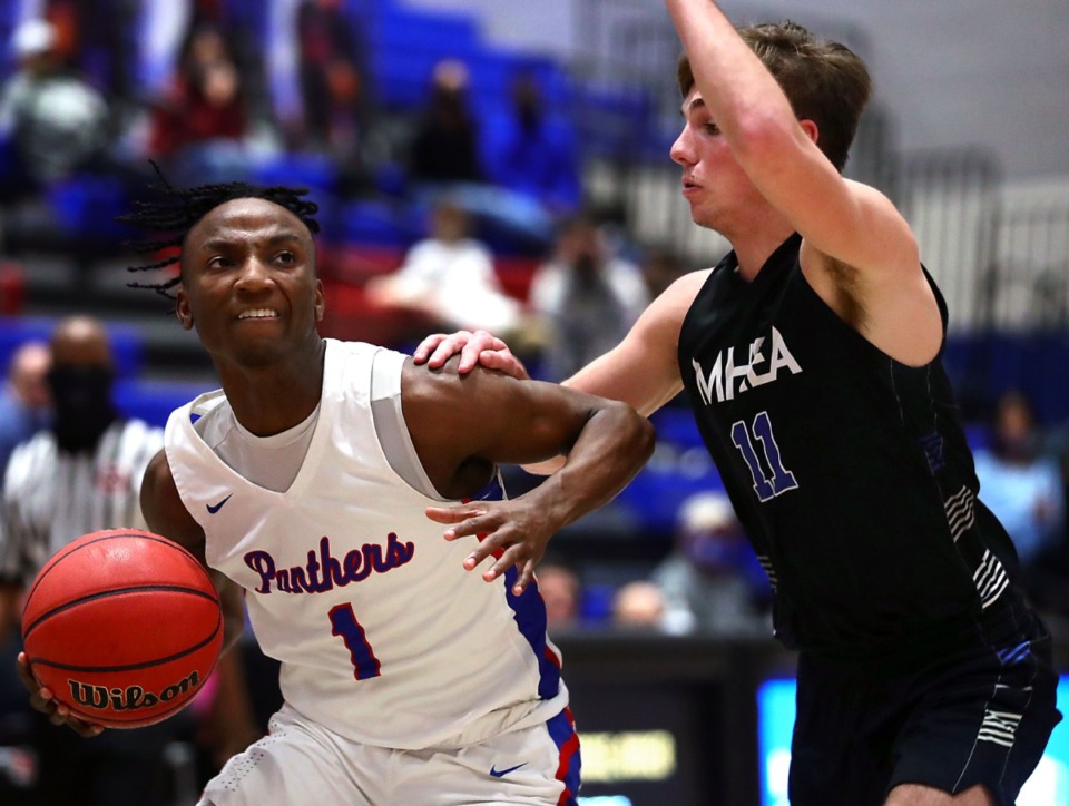 <strong>Bartlett High School guard Amarr Knox (1) drives to the basket during a Jan. 28, 2020 game against Memphis Home Education Association.</strong> (Patrick Lantrip/Daily Memphian file)