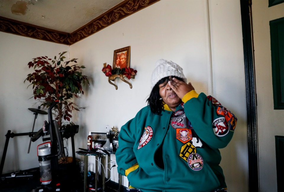 <strong>Esther Cook, an Orange Mound resident, holds back tears as she discusses her need for help on Tuesday, Feb. 8, after a tree ripped a hole in her roof during the Feb. 3 ice storm. Cook, who lives on a $1,000 monthly disability check, cannot afford to have the roof repaired.</strong> (Mark Weber/Daily Memphian)