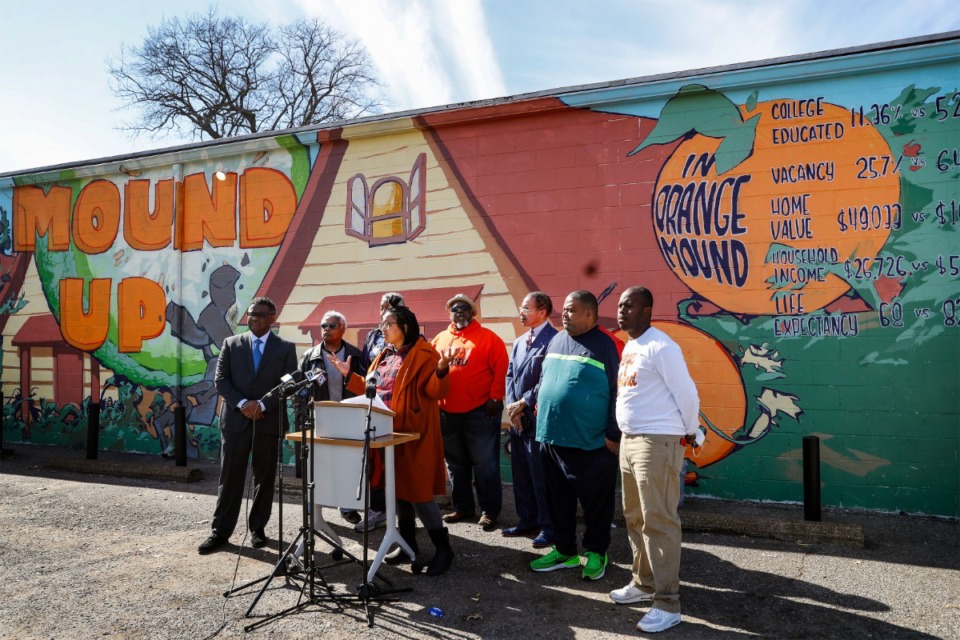 <strong>Juice Orange Mound founder Britney Thornton (middle) answers questions during a press conference, on Thursday, Feb. 10, 2022, regarding the closure of JUICE Orange Mound's homeless shelter days before the recent ice storm. Melvin Burgess, Shelby County Assessor of Property, is calling for local governmental support for the shelter.</strong> (Mark Weber/The Daily Memphian)