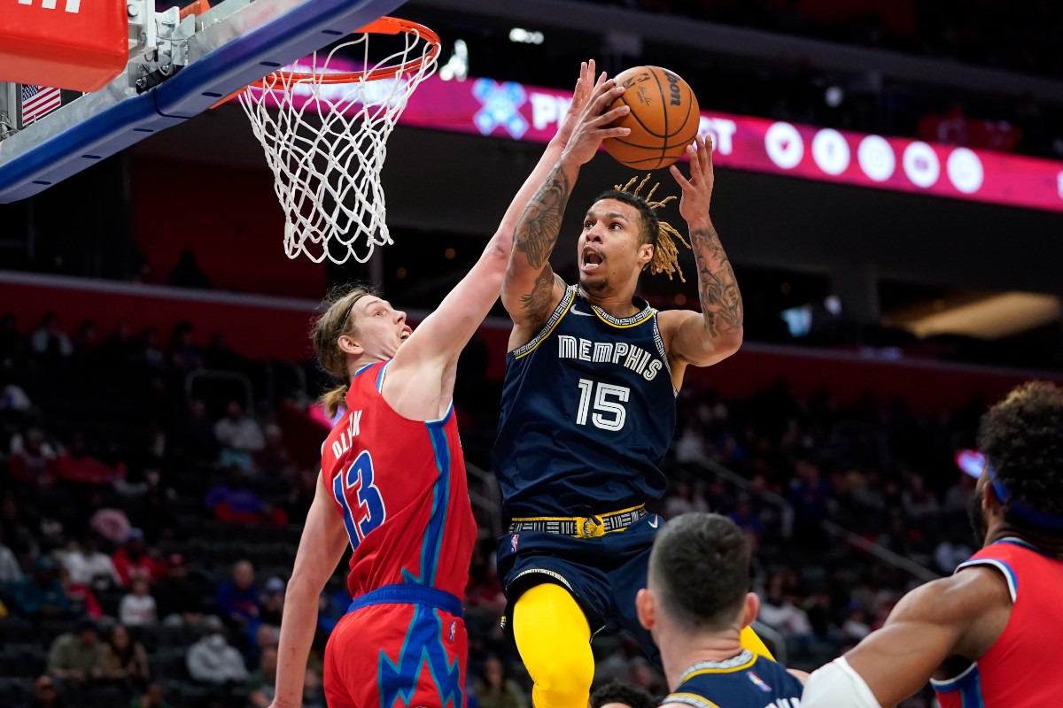 <strong>Grizzlies forward Brandon Clarke (15) goes up for a basket against Detroit Pistons forward Kelly Olynyk (13) on Feb. 10 in Detroit.</strong> (Paul Sancya/AP)