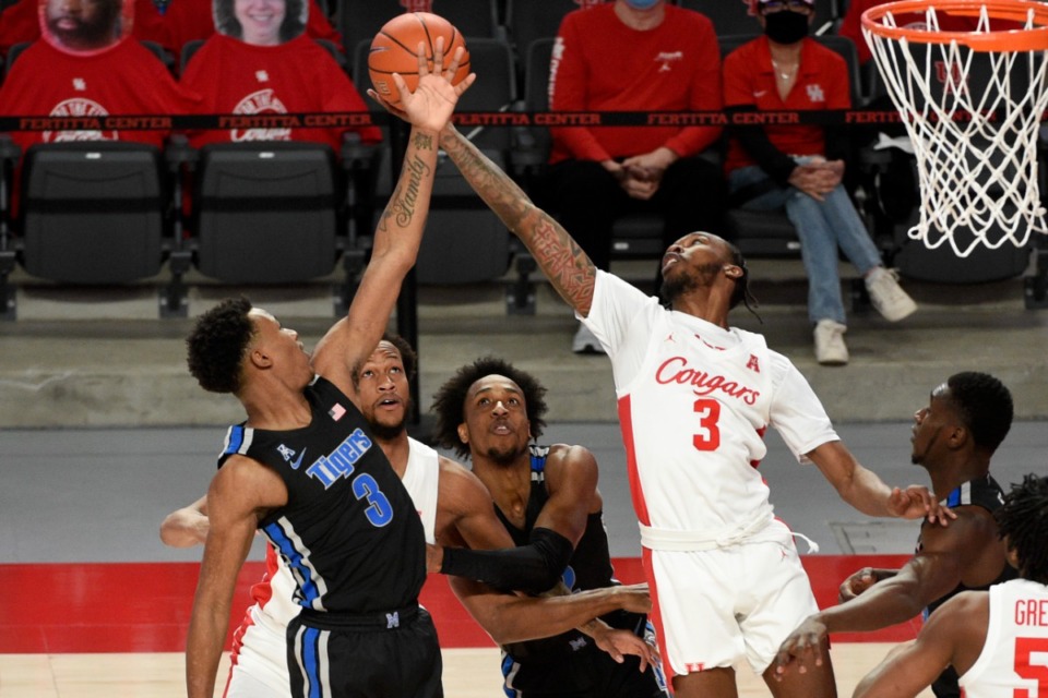<strong>Memphis guard Landers Nolley II, left, and DeJon Jarreau (3) reach for a rebound during the first half of an NCAA college basketball game, Sunday, March 7, 2021, in Houston.</strong> (AP Photo/Eric Christian Smith)