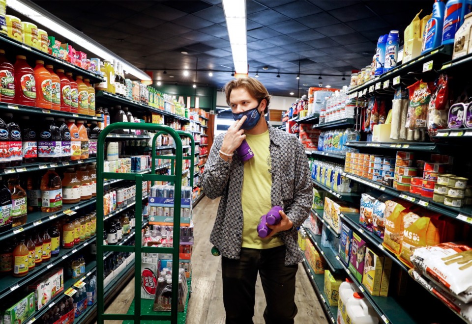 <strong>David Finley stocks shelves at Cordelia's Market on Mud Island on Thursday, Feb. 10.&nbsp;Since the beginning of the pandemic in March 2020, consumers have faced challenges with finding grocery items they need.</strong> (Mark Weber/Daily Memphian)