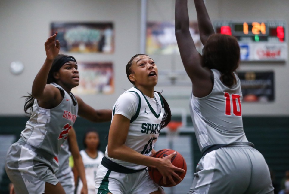 <strong>White Station guard Sihirah Reese (15) goes up for a layup during a Feb. 12, 2022 game against Germantown.</strong> (Patrick Lantrip/Daily Memphian)