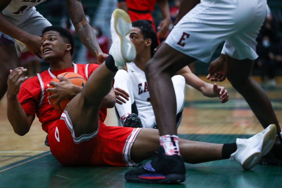 <strong>Germantown guard Josh Davis (10) dives for a loose ball during a Feb. 12, 2022 game against East.</strong> (Patrick Lantrip/Daily Memphian)