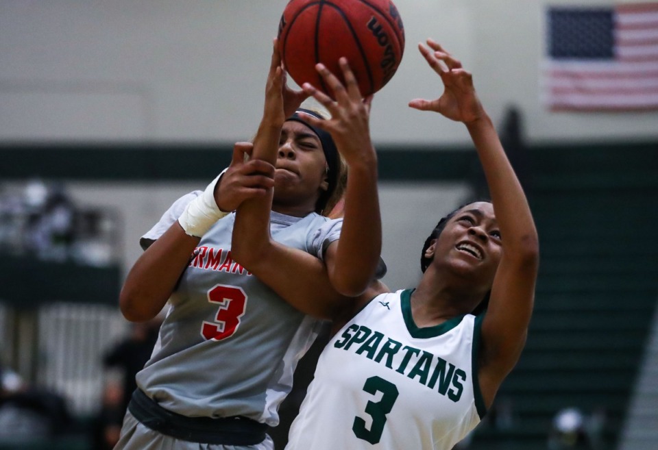 <strong>White Station guard guard Ramya King (3) fights for a loose rebound during a Feb. 12, 2022 game against Germantown.</strong> (Patrick Lantrip/Daily Memphian)