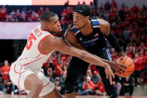 <strong>Houston forward Fabian White Jr. (35) reaches in as Memphis forward DeAndre Williams, right, looks for a shot during the first half of an NCAA college basketball game Saturday, Feb. 12, 2022, in Houston.</strong> (AP Photo/Michael Wyke)