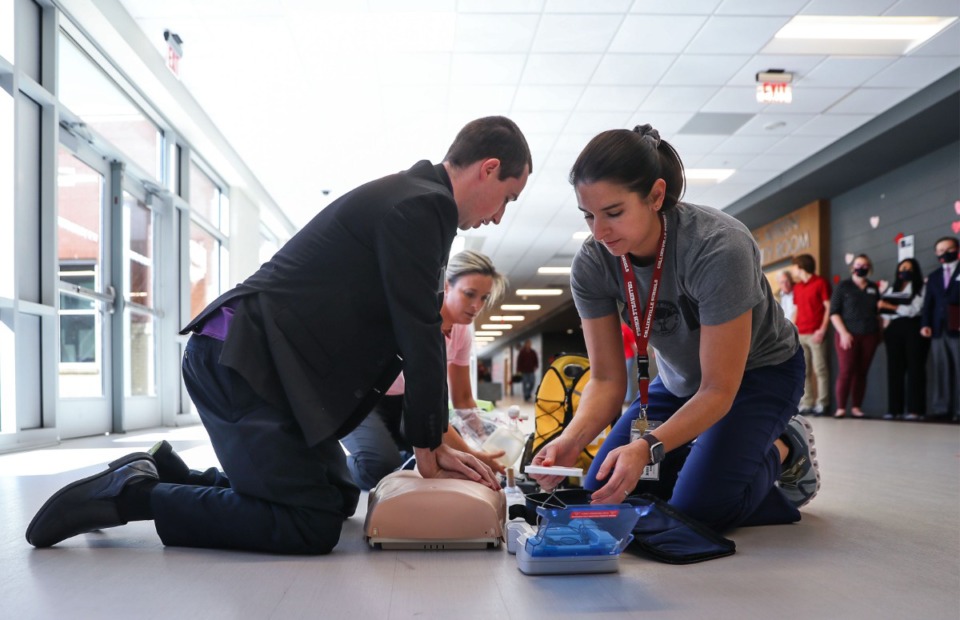 <strong>Jason Sharp (from left), Jaimee Lapham and Jenna Connelly perform a cardiac arrest drill at Collierville High School on Monday, Feb. 14. CHS became the first &ldquo;Heart Safe School&rdquo; in West Tennessee&rsquo;s Project ADAM.</strong> (Patrick Lantrip/Daily Memphian)