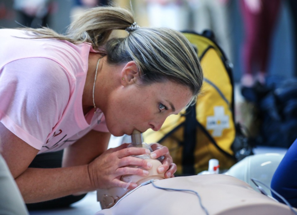 <strong>Jaimee Lapham administers CPR during a cardiac arrest drill at Collierville High School in front of a group of certifying doctors from Le Bonheur Children's Hospital Feb. 14, 2022.</strong> (Patrick Lantrip/Daily Memphian)