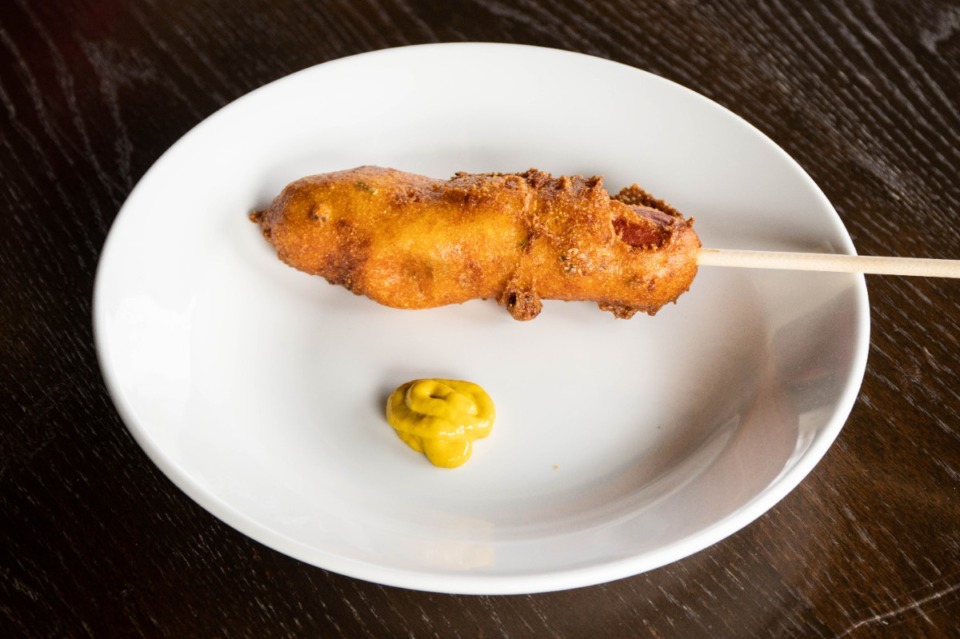 <strong>The corndog at Sweet Grass&nbsp;is a quarter-pound Nathan&rsquo;s all-beef dog, dredged in a mix that Jennifer Biggs has compared to cornbread but is, as Ryan Trimm says, more like a hush puppy batter.</strong>&nbsp;(Meka Wilson/Daily Memphian)