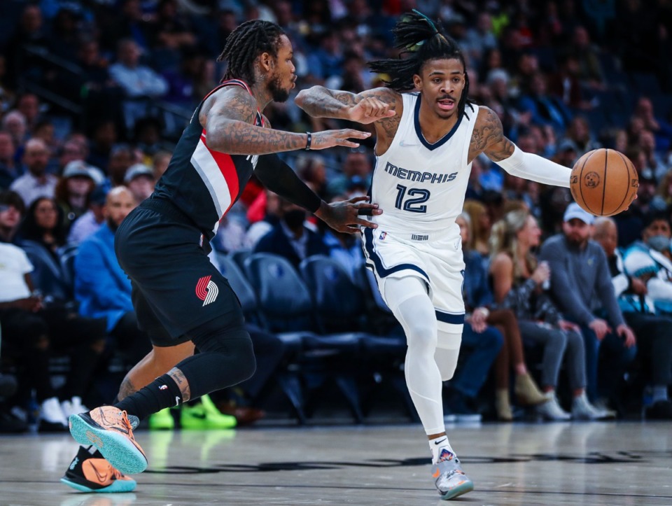 <strong>Memphis Grizzlies guard Ja Morant (12) brings the ball upcourt during the Feb. 16, 2022, game against the Portland Trail Blazers.</strong> (Patrick Lantrip/Daily Memphian)