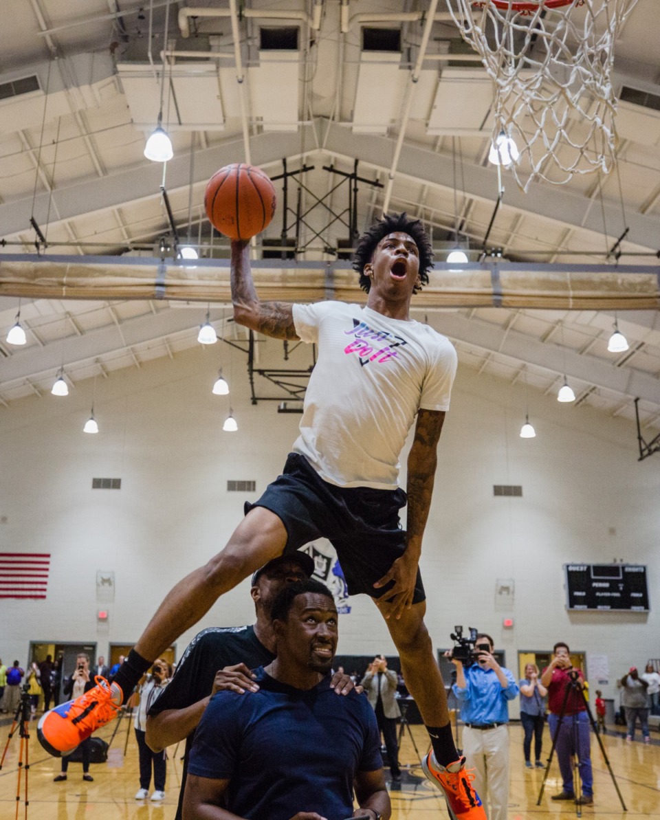 <strong>Ja Morant&nbsp; soars over two men on the way to a dunk on Ja Morant Day at Crestwood High School in Dalzell.</strong> (Micah Green/Sumter Item)