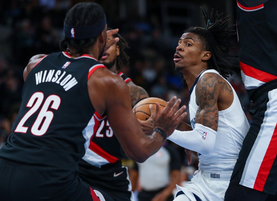 <strong>Memphis Grizzlies guard Ja Morant (12) drives to the basket in the Feb. 16, 2022, game against the Portland Trail Blazers.</strong> (Patrick Lantrip/Daily Memphian)