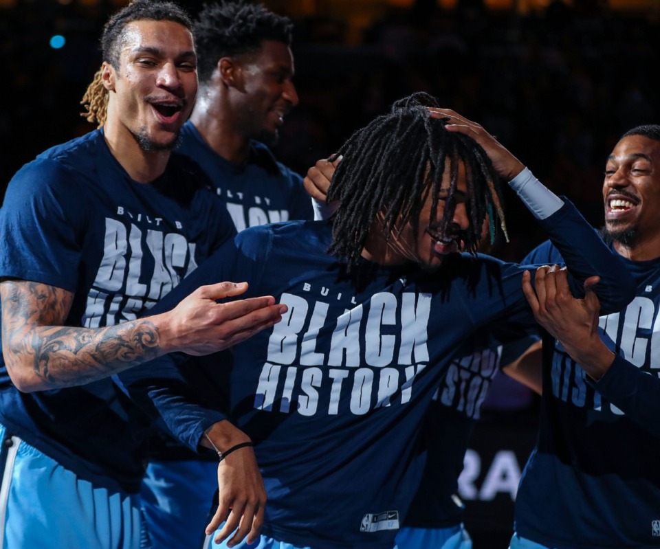 <strong>Memphis Grizzlies guard Ja Morant (12) is surrounded by teamates while being introduced as an All-Star before the Feb. 16, 2022, game against the Portland Trail Blazers.</strong> (Patrick Lantrip/Daily Memphian)