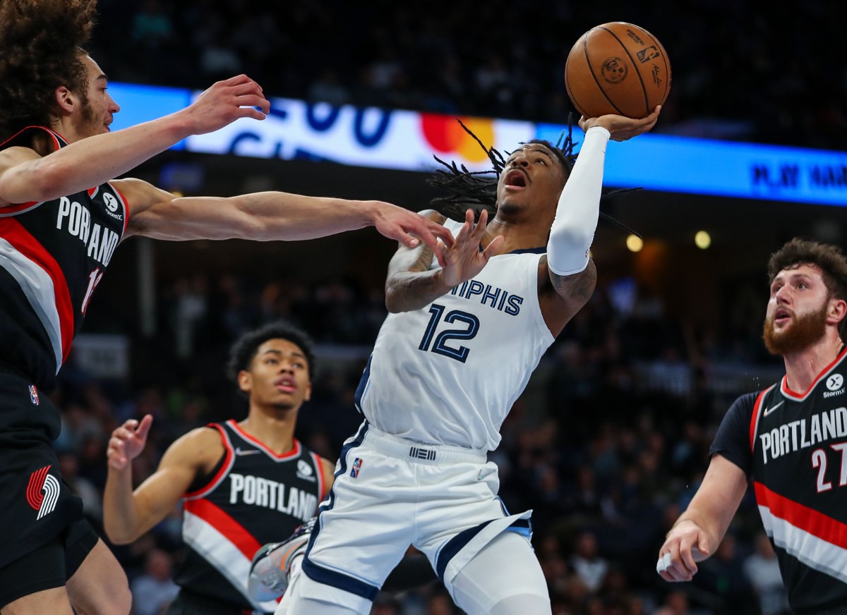 <strong>Memphis Grizzlies guard Ja Morant (12) floats a shot during the Feb. 16, 2022, game against the Portland Trail Blazers.</strong> (Patrick Lantrip/Daily Memphian)