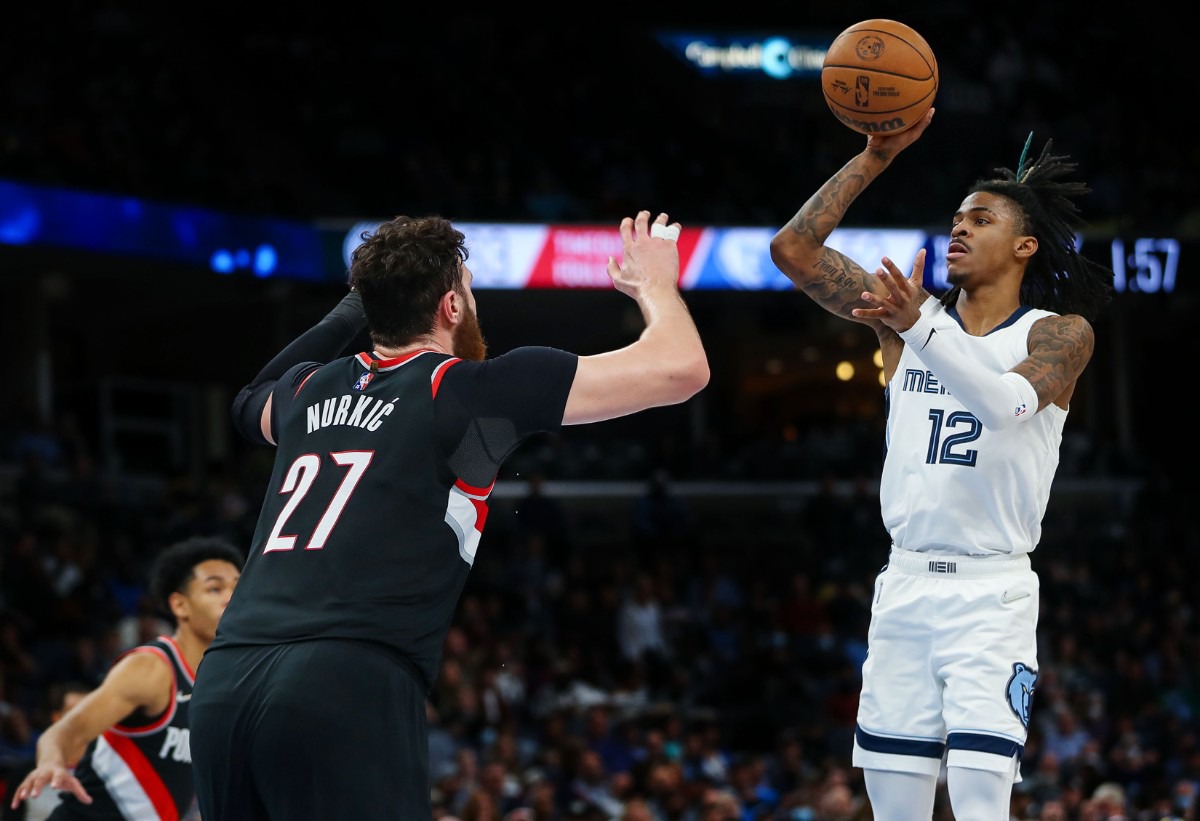 <strong>Memphis Grizzlies guard Ja Morant (12) shoots a jumper during the Feb. 16, 2022, game against the Portland Trail Blazers.</strong> (Patrick Lantrip/Daily Memphian)