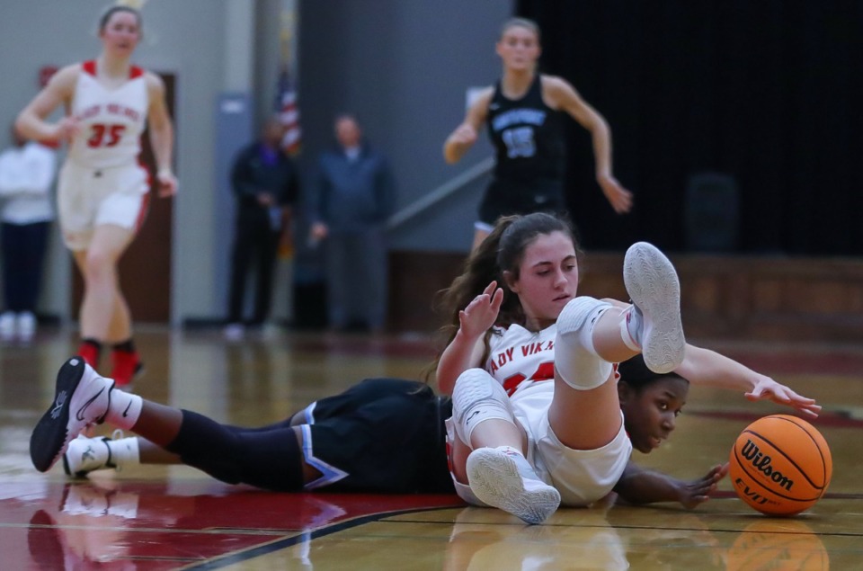 <strong>Northpoint Christian School's Karrington Edwards (3) and Fayette Academy's Annie Thornton (24) tussle for a loose ball&nbsp;in a regional semifinal match&nbsp;on Feb. 17, 2022.</strong> (Patrick Lantrip/Daily Memphian)