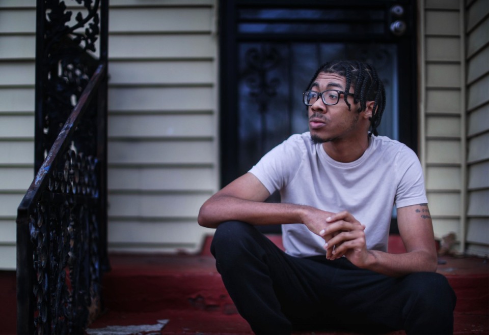 <strong>Keatric Reed sits on the porch of his home in the Alcy Ball neighborhood in South Memphis. Reed, 24, is one of three homeowners to have utilized Alcy Ball Development Corp.'s homebuyers program.</strong> (Patrick Lantrip/Daily Memphian)