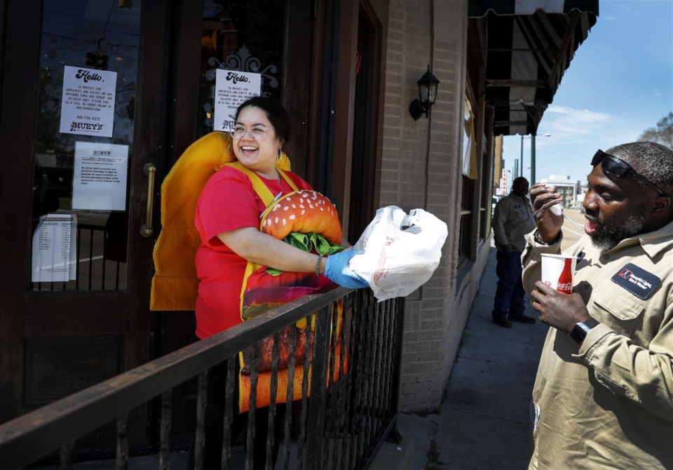 <strong>When COVID started, Huey&rsquo;s dropped the to-go fee they&rsquo;d been charging and added an automatic tip for employees, like Jenna Cousino. But other restaurants are feeling the pinch of packaging and are starting to add a takeout surcharge. </strong>&nbsp;(Mark Weber/Daily Memphian file)
