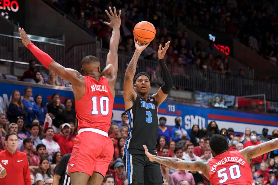 <strong>SMU guard Zach Nutall (10) and forward Marcus Weathers (50) defend as Memphis guard Landers Nolley II (3) takes a shot in the first half of an NCAA college basketball game in Dallas, Sunday, Feb. 20, 2022.</strong> (AP Photo/Tony Gutierrez)