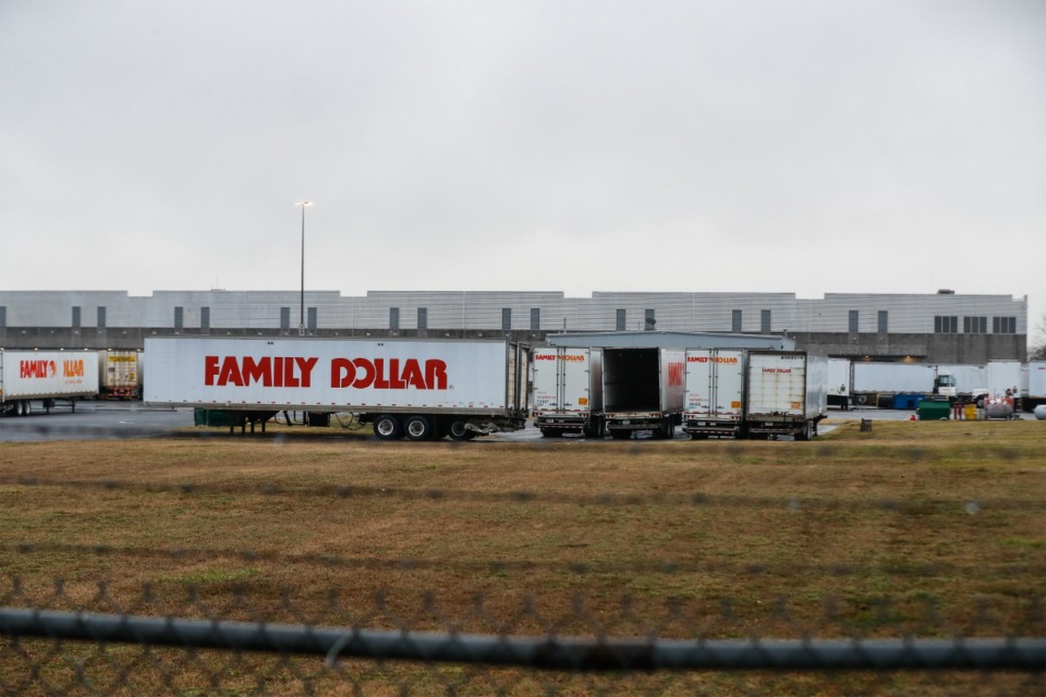 <strong>Trucks are parked outside the Family Dollar Distribution Center at 1800 Family Dollar Drive in West Memphis, Monday, Feb. 21. FDA officials said a consumer complaint prompted inspection of the facility.</strong> (Mark Weber/The Daily Memphian)