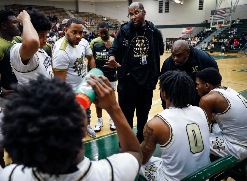 <strong>Whitehaven head coach Fred Horton (middle) talks to his players during a timeout in the game against Overton on Monday, Feb. 21, 2022.</strong> (Mark Weber/The Daily Memphian)