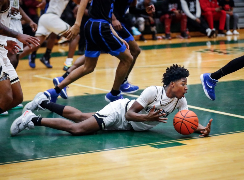 <strong>Whitehaven&rsquo;s Julius Thedford grabs a loose ball in the game against Overton on Monday, Feb. 21, 2022.</strong> (Mark Weber/The Daily Memphian)