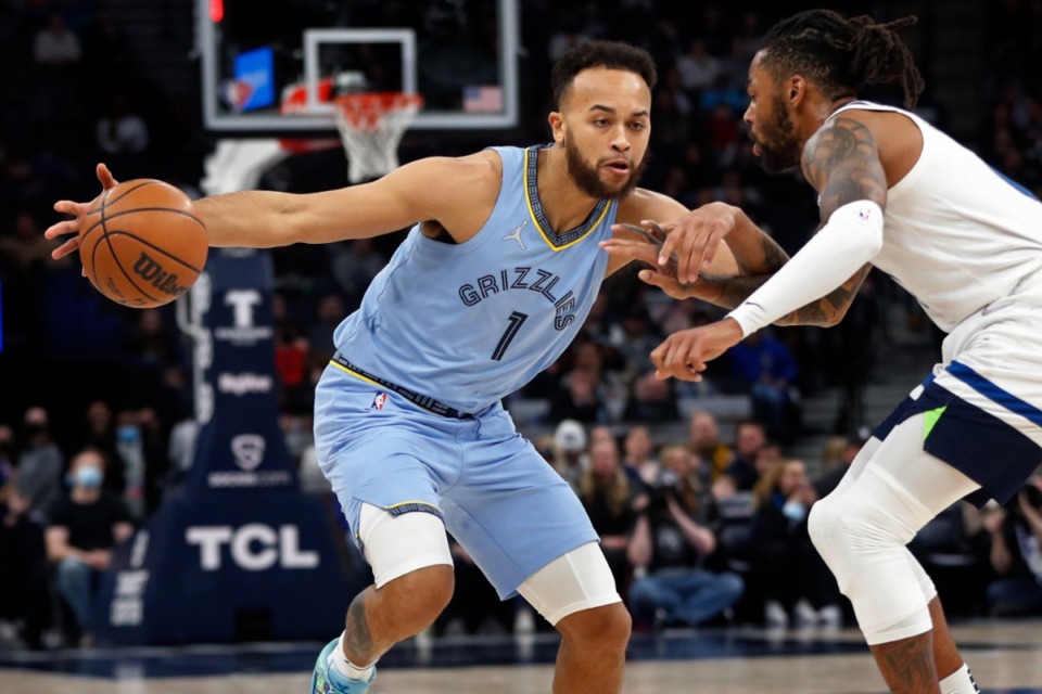 <strong>Memphis Grizzlies forward Kyle Anderson (1) dribbles around Minnesota Timberwolves guard D'Angelo Russell on Feb. 24, 2022, in Minneapolis.</strong> (Bruce Kluckhohn/AP)