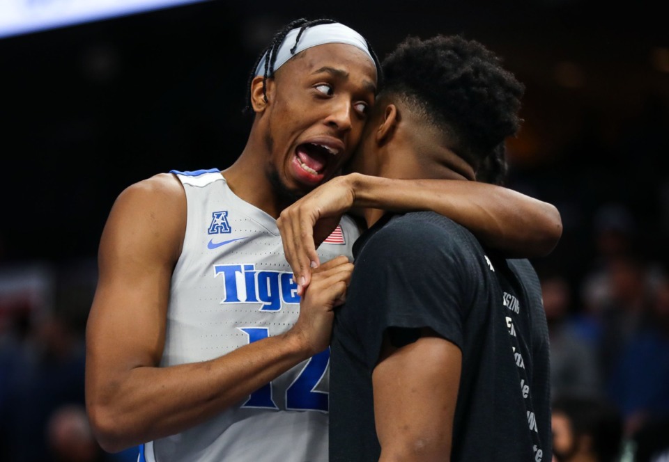 <strong>University of Memphis forward Deandre Williams celebrates with teammate Earl Timberlake during the game against Temple at FedExForum on Feb. 24.</strong> (Patrick Lantrip/Daily Memphian)