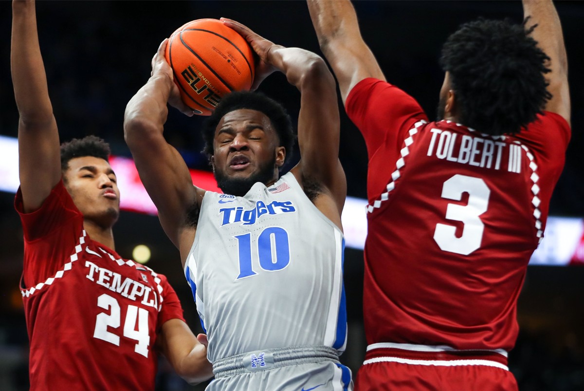 <strong>University of Memphis guard Alex Lomax (10) battles Temple for a rebound on Feb. 24 at FedExForum.</strong> (Patrick Lantrip/Daily Memphian)