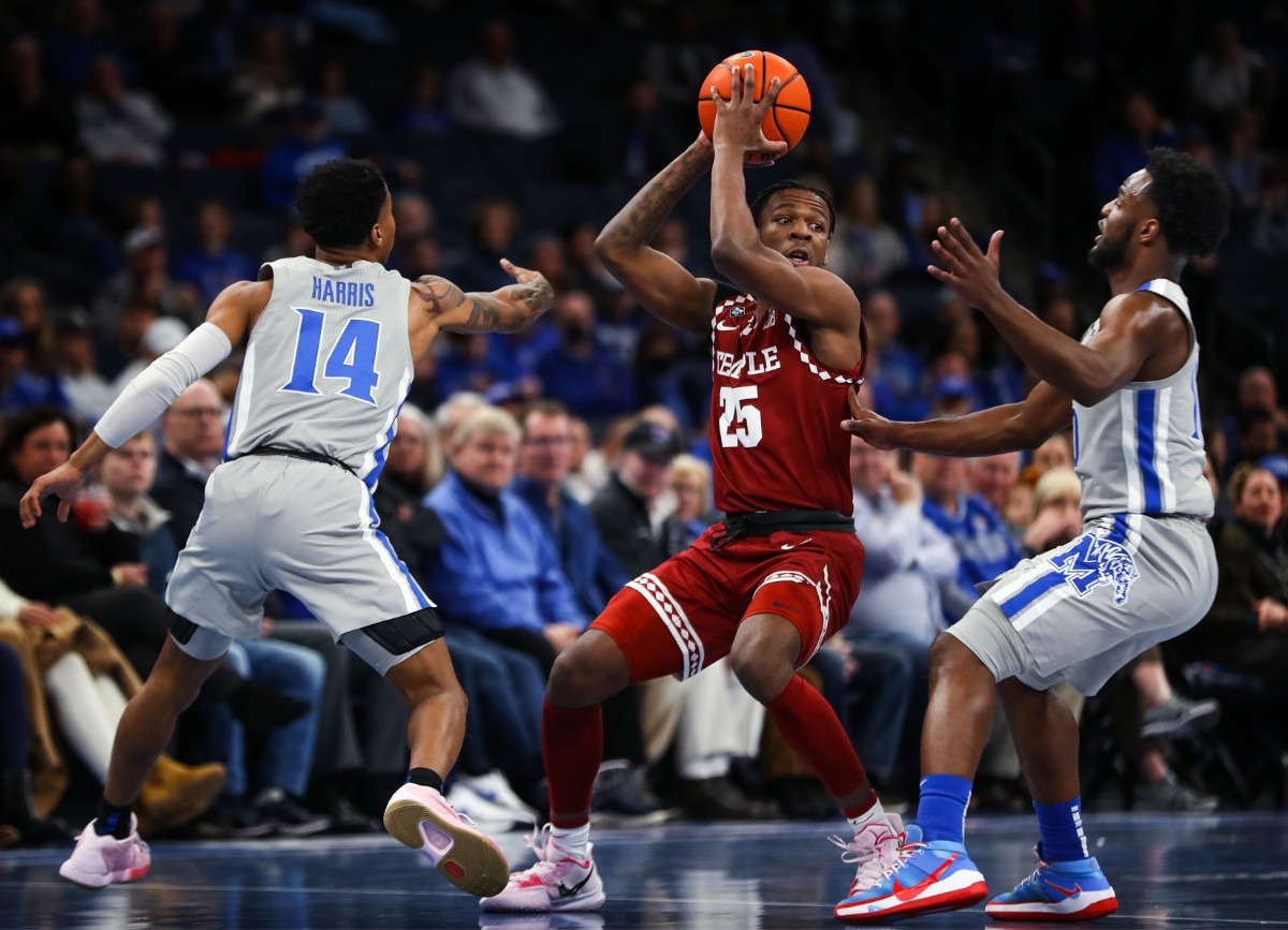 <strong>University of Memphis guards Alex Lomax (10) and Tyler Harris (14) trap Temple guard Jeremiah Williams (25) on Feb. 24 at FedExForum.</strong> (Patrick Lantrip/Daily Memphian)