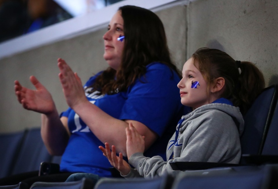 <strong>Lifelong Penny Hardaway fan Julie Barrett and her daughter Maci cheer on the Tigers during the Feb. 24 game against Temple at FedExForum.</strong> (Patrick Lantrip/Daily Memphian file)